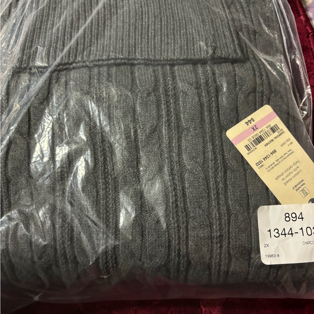 Women’s cable sweater.
